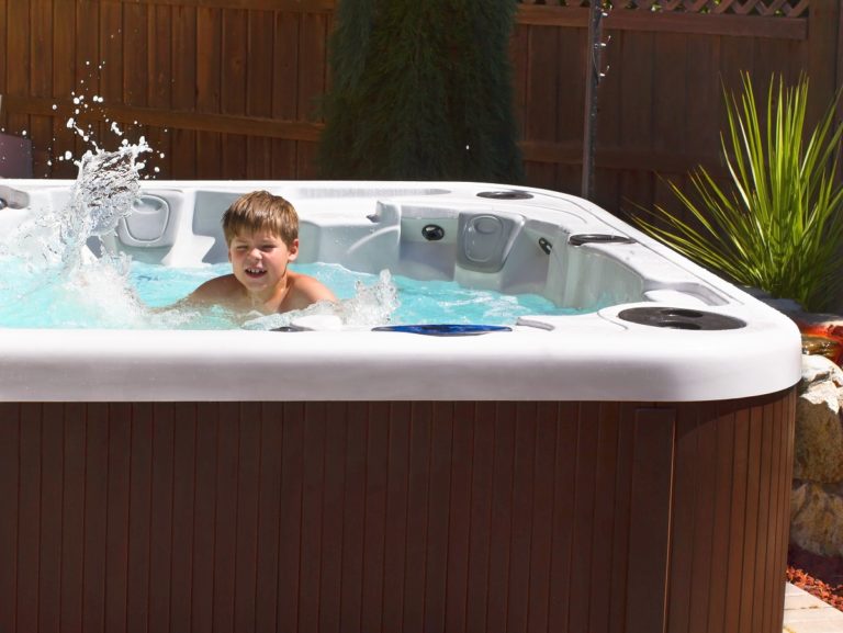 Kid playing in a hot tub