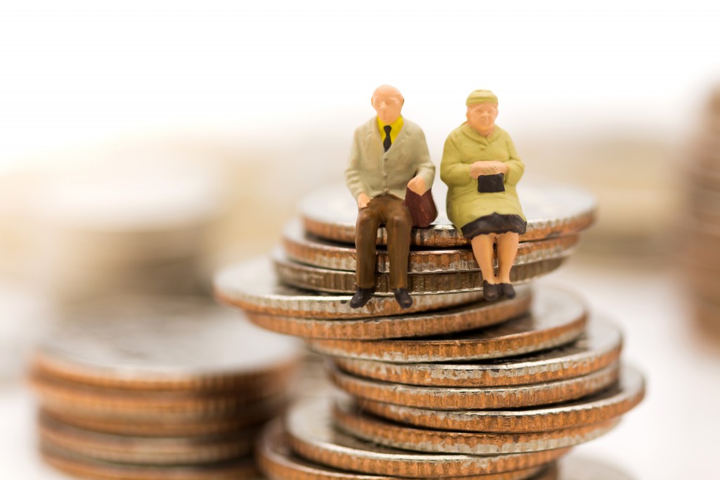 senior figures sitting on coins
